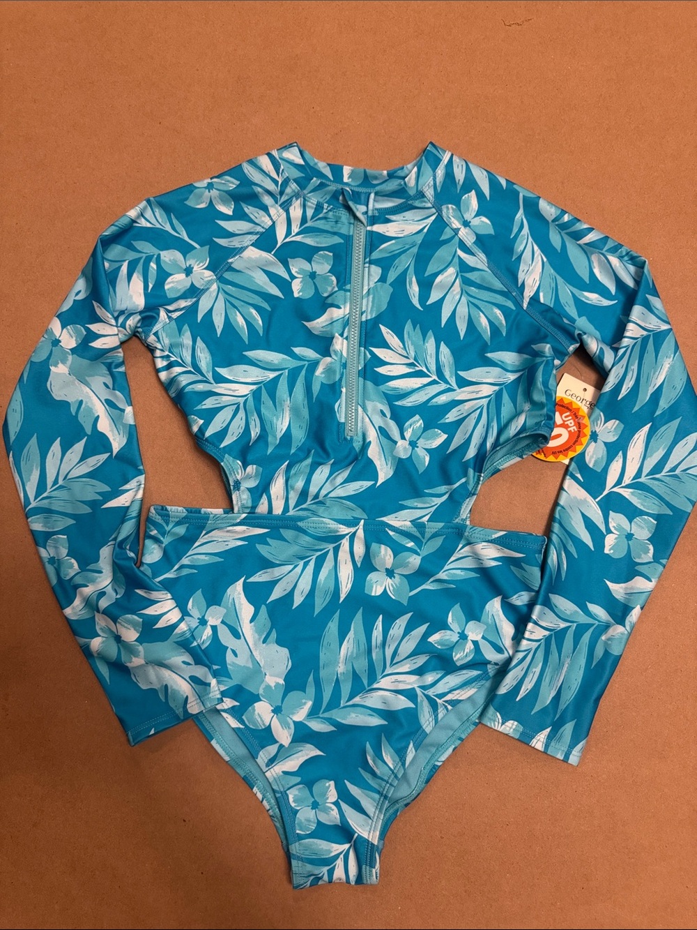 George Blue and White Tropical-Print Long Sleeve One-Piece sides cutout style